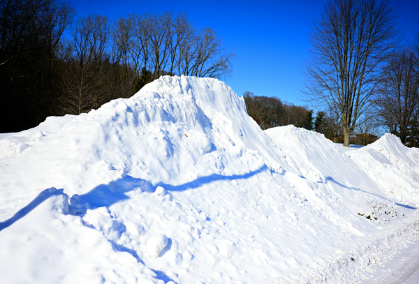 Large snow pile cleared from a commercial parking lot on Cape Cod
