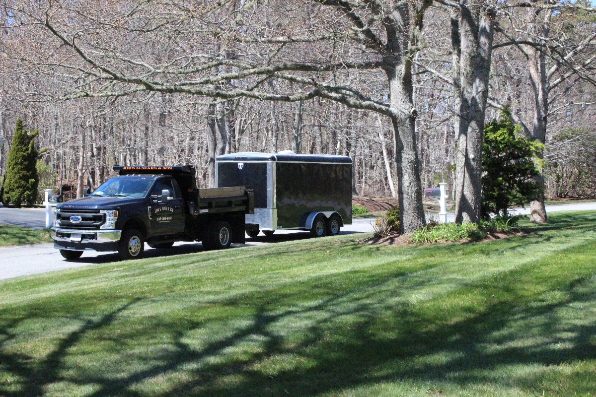 John G. Sears & Son lawn care crew and truck at a Cape Cod property